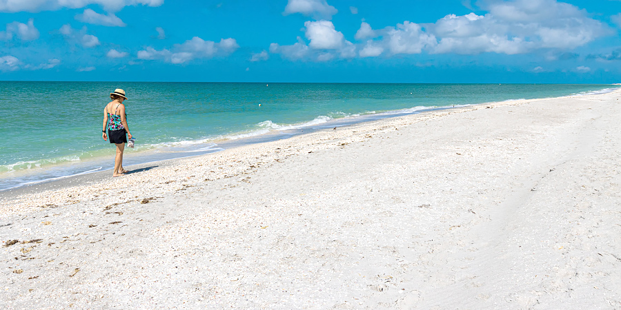 Woman shelling on Sanibel Island.